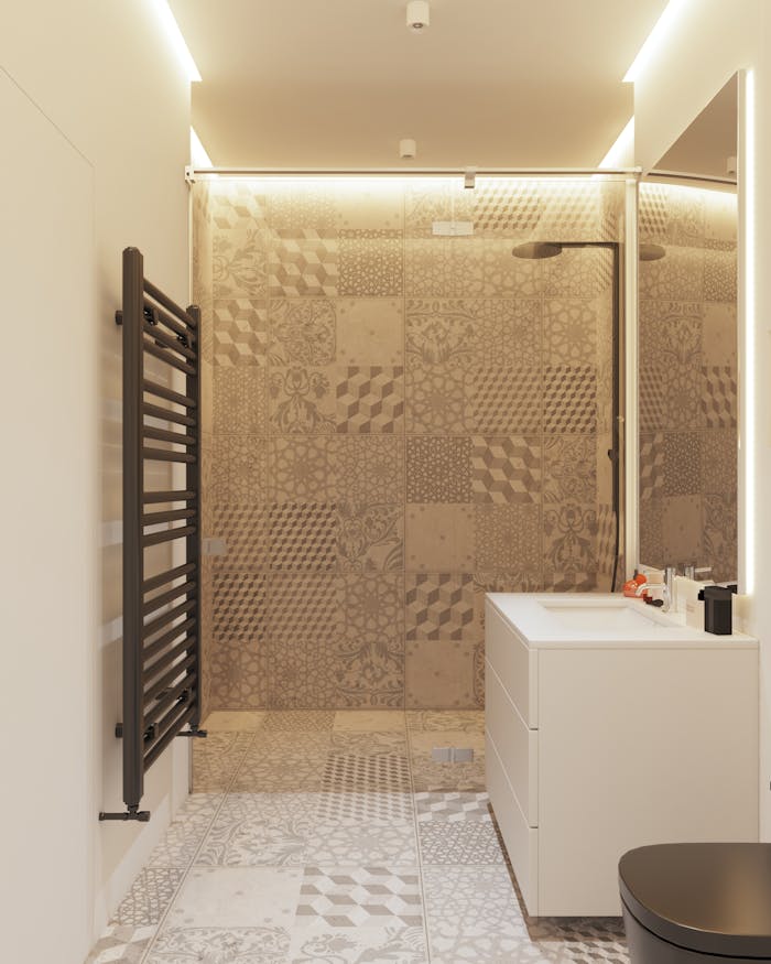 Stylish minimalist bathroom featuring intricate patterned tiles and sleek fixtures.